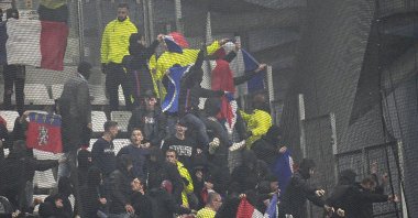 Lyon fans try to break the net on the stands prior to the French Ligue 1 match against Marseille, Velodrome Stadium, Marseille, France, Oct. 29, 2023. (AP Photo)