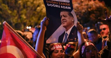 Supporters of President Recep Tayyip Erdoğan cheer outside AK Party (Justice and Development Party) headquarters in Istanbul, Türkiye, May 14, 2023. (AP Photo)