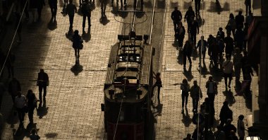 People walk on famed Istiklal Avenue, in Istanbul, Türkiye, Oct. 25, 2023. (AP Photo)