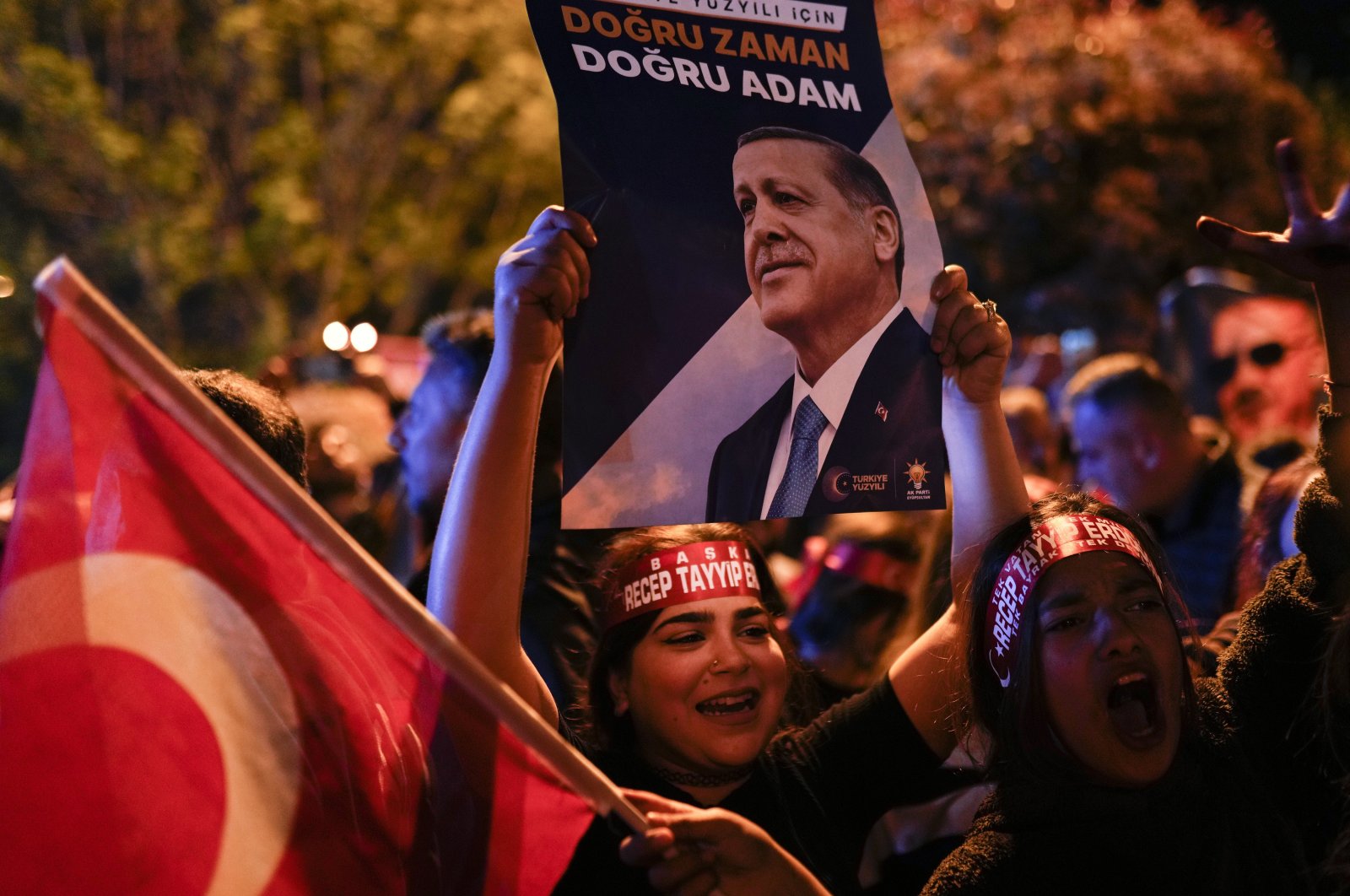 Supporters of President Recep Tayyip Erdoğan cheer outside AK Party (Justice and Development Party) headquarters in Istanbul, Türkiye, May 14, 2023. (AP Photo)