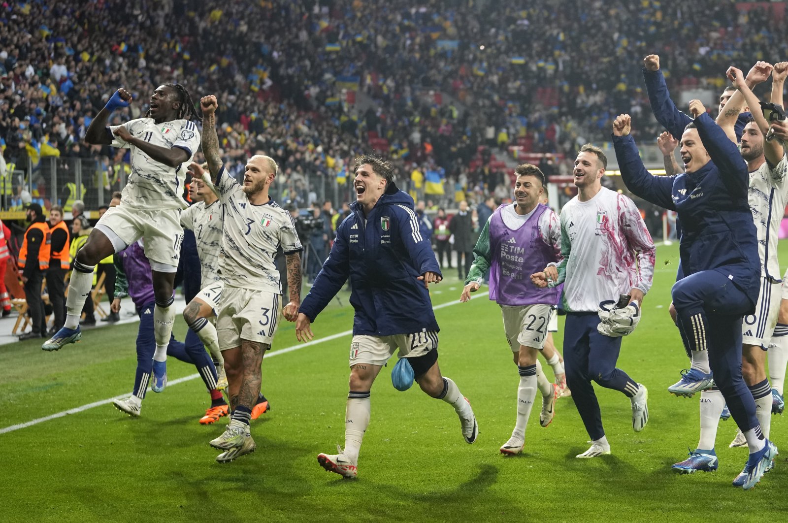 Italy players celebrate their qualifying after the Euro 2024 group C qualifying match between Ukraine and Italy at the BayArena, Leverkusen, Germany, Nov. 20, 2023. (AP Photo)