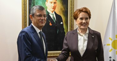 Republican People's Party (CHP) Chair Özgür Özel (L) shakes hands with Good Party (IP) leader Meral Akşener ahead of their meeting at IP headquarters in Ankara, Türkiye, Nov. 30, 2023. (AA Photo)