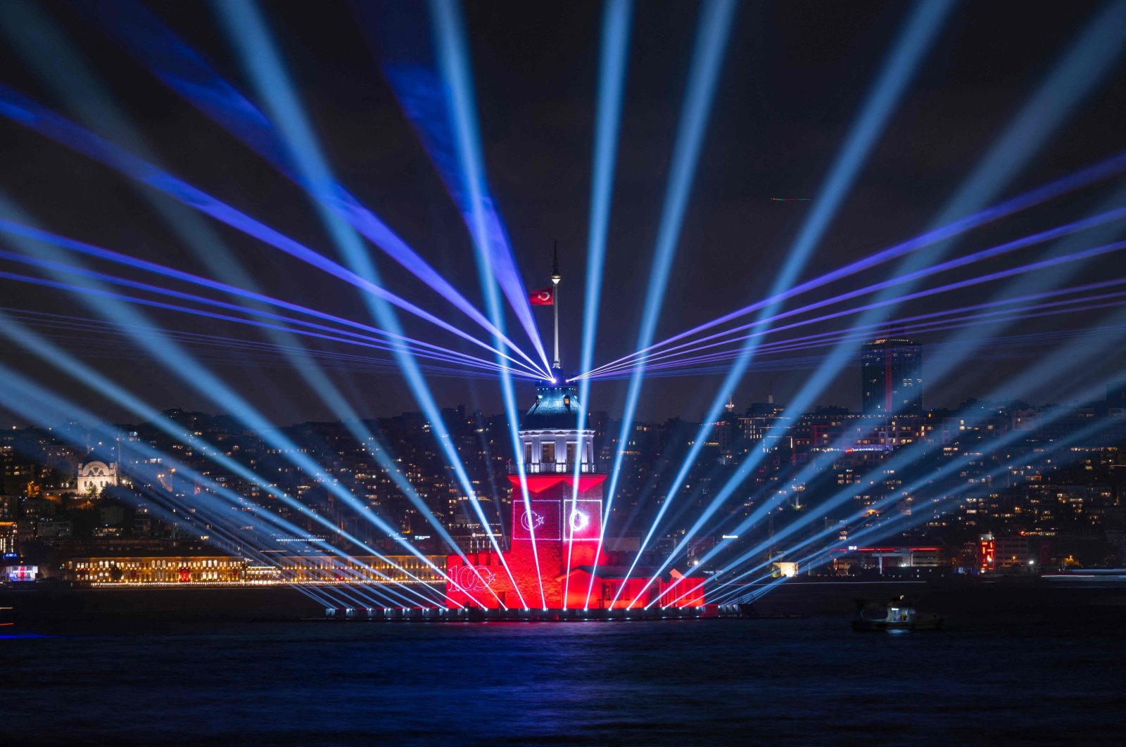A photograph taken in Istanbul on Oct. 29, 2023, shows the Turkish flag flying on the illuminated Maiden&#039;s Tower during celebrations to mark the 100th anniversary of the Turkish Republic. (AFP Photo)