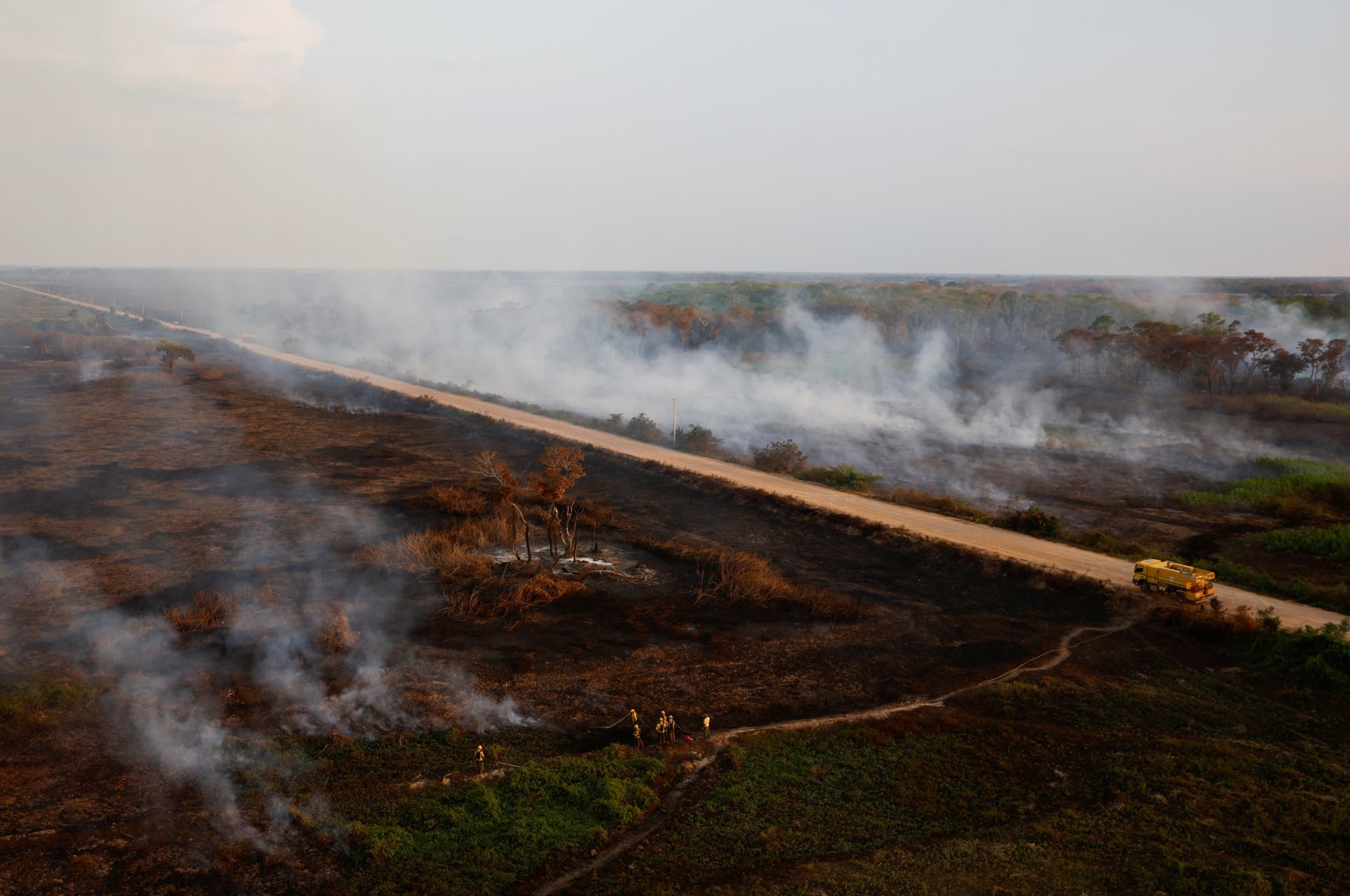 Agents of ICMBio (Chico Mendes Institute for Biodiversity Conservation) and IBAMA (Brazilian Institute for the Environment and Renewable Natural Resources) work to extinguish a fire in the Pantanal, the world&#039;s largest wetland, in Pocone, Mato Grosso state, Brazil Nov. 21, 2023. (Reuters Photo)