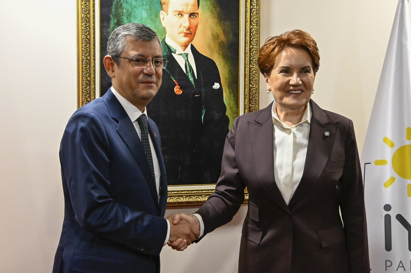 Republican People&#039;s Party (CHP) Chair Özgür Özel (L) shakes hands with Good Party (IP) leader Meral Akşener ahead of their meeting at IP headquarters in Ankara, Türkiye, Nov. 30, 2023. (AA Photo)