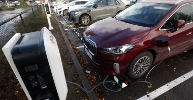 A BMW electric vehicle is being charged in a charging station in Drogenbos, Belgium, Nov. 25, 2023. (Reuters Photo)