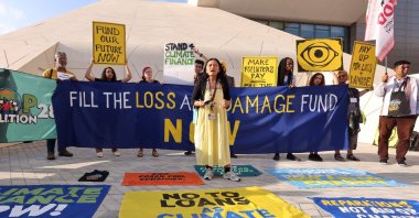 Activists participate in a demonstration for the "Loss and Damage" fund at the U.N. climate summit COP28 in Dubai, United Arab Emirates, Dec. 4, 2023. (AFP Photo)