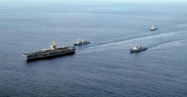 A handout photo made available by the U.S. Navy shows (L-R) the nuclear-powered aircraft carrier USS Carl Vinson, the Japan Maritime Self-Defense Force's destroyer Kirisame, South Korea's Aegis-equipped destroyer Sejong the Great, and the guided-missile destroyer USS Kidd sailing in southeastern waters off Jeju Island, South Korea, Nov. 26, 2023. (EPA Photo)
