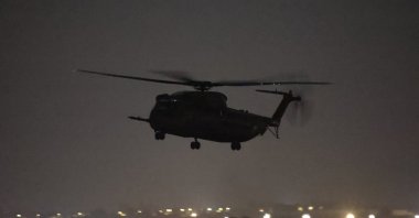 An Israeli army helicopter landing near the Kerem Shalom crossing between Gaza and Israel, Nov. 24, 2023. (EPA Photo)    