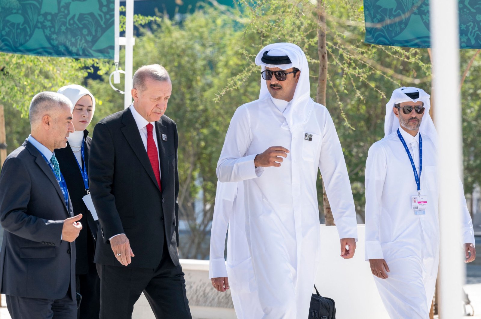 Emir of Qatar Sheikh Tamim bin Hamad Al Thani (C-R) speaks to President Recep Tayyip Erdoğan, prior to the opening ceremony of the COP28 climate summit in Dubai, United Arab Emirates, Dec. 1, 2023. (AFP Photo)