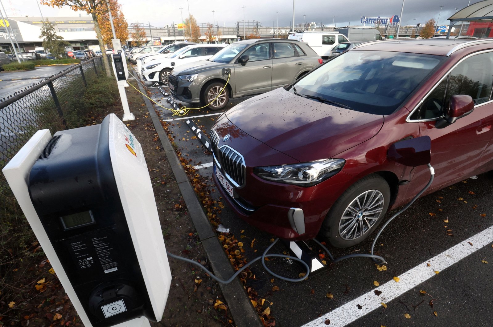 A BMW electric vehicle is being charged in a charging station in Drogenbos, Belgium, Nov. 25, 2023. (Reuters Photo)