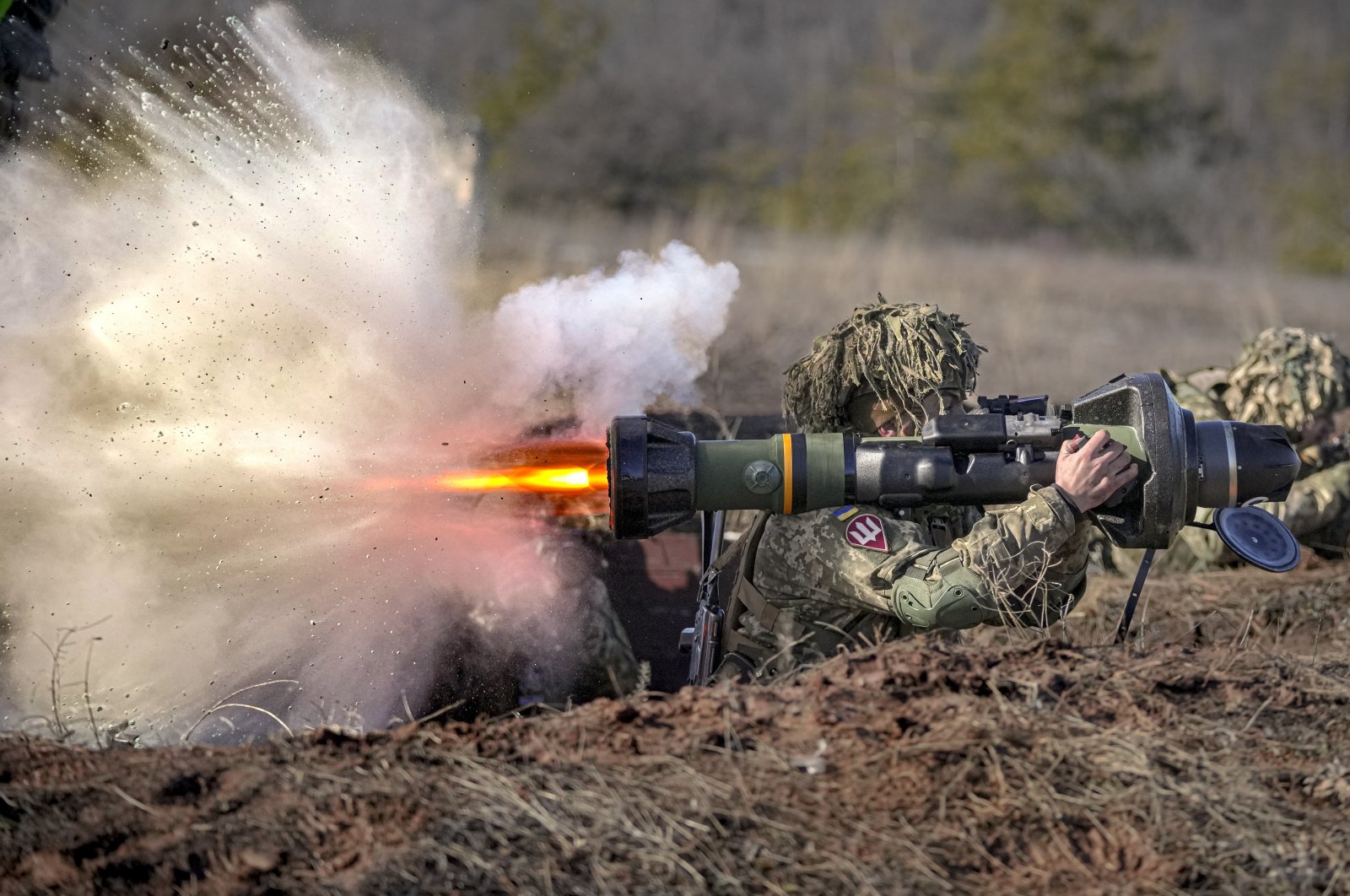A Ukrainian serviceman fires an NLAW anti-tank weapon during an exercise in the Joint Forces Operation, in Donetsk region, Ukraine, Feb. 15, 2022. (AP Photo)