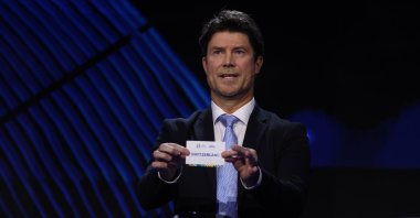 Special guest Brian Laudrup pulls out the card of Switzerland during the UEFA EURO 2024 Final Tournament Draw at Elbphilharmonie, Hamburg, Germany, Dec. 2, 2023. (Getty Images Photo)