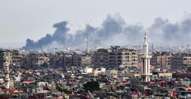 Smoke billows above buildings after an Israeli strike on the outskirts of Damascus, Syria, Nov. 22, 2023. (AFP Photo)