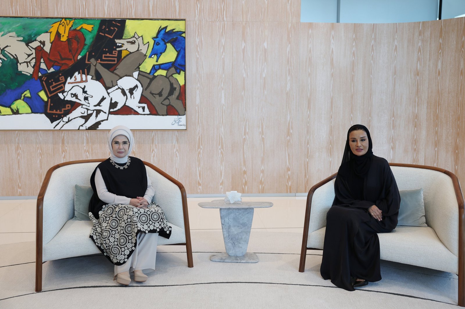 First lady Emine Erdoğan (L) and Sheikha Moza bint Nasser Al Missned, the head of the Qatar Foundation and mother of the Qatari emir, pose ahead of their meeting in Doha, Qatar, Dec. 5, 2023. (AA Photo)