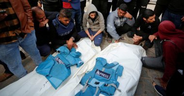 Palestinians mourn local journalists Hassouna Sleem and Sary Mansour, who were killed in an Israeli strike on a house, at a hospital in the central Gaza Strip, Palestine, Nov. 19, 2023. (Reuters Photo)