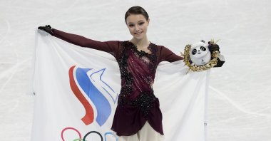 Russia's gold medallist Anna Shcherbakova celebrates during the Women Single Skating Free Skating flower ceremony on day thirteen of the Beijing 2022 Winter Olympic Games at Capital Indoor Stadium, Beijing, China, Feb. 17, 2022. (Getty Images Photo)