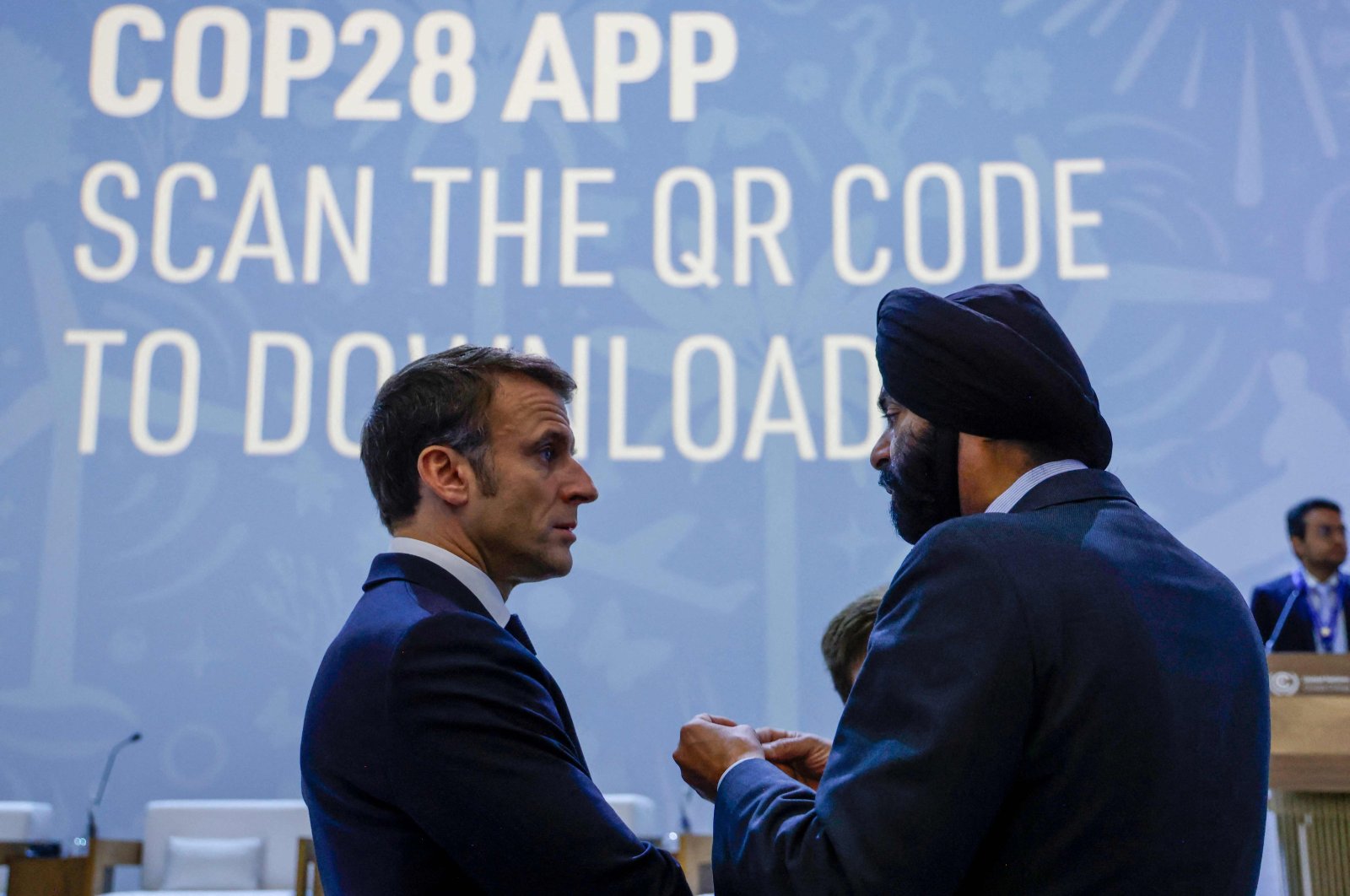 France&#039;s President Emmanuel Macron (L) listens to World Bank President Ajay Banga during the Transforming Climate Finance session at the United Nations climate summit in Dubai, United Arab Emirates, Dec. 1, 2023. (AFP Photo)