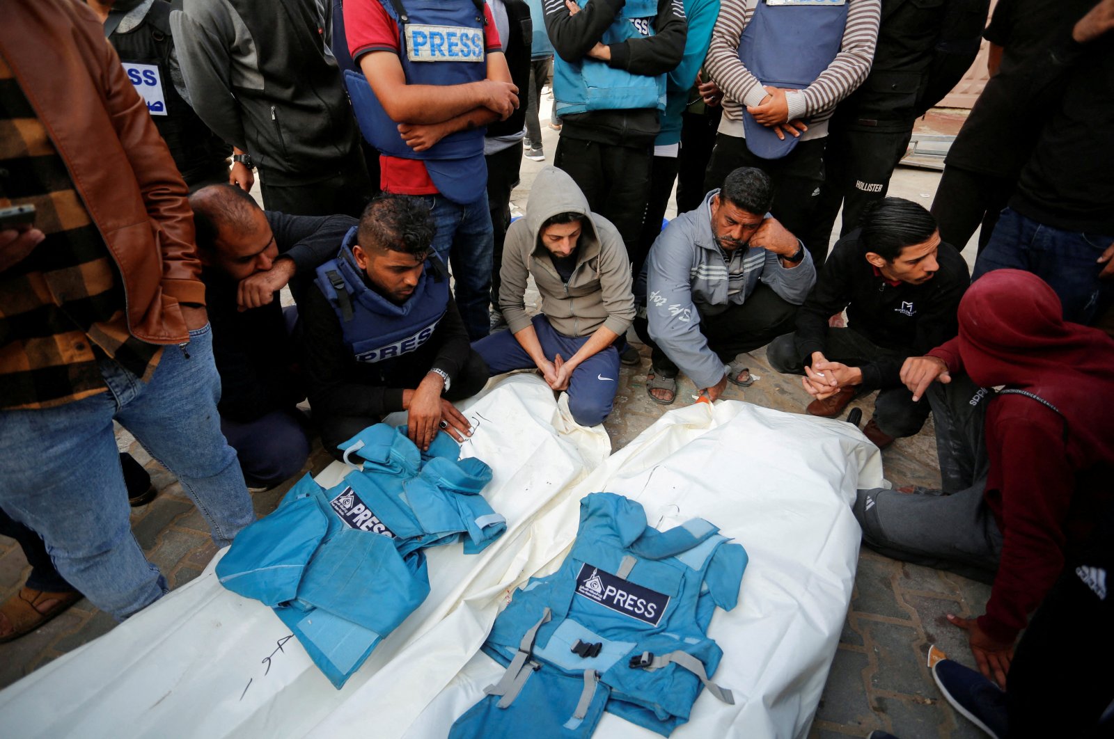 Palestinians mourn local journalists Hassouna Sleem and Sary Mansour, who were killed in an Israeli strike on a house, at a hospital in the central Gaza Strip, Palestine, Nov. 19, 2023. (Reuters Photo)
