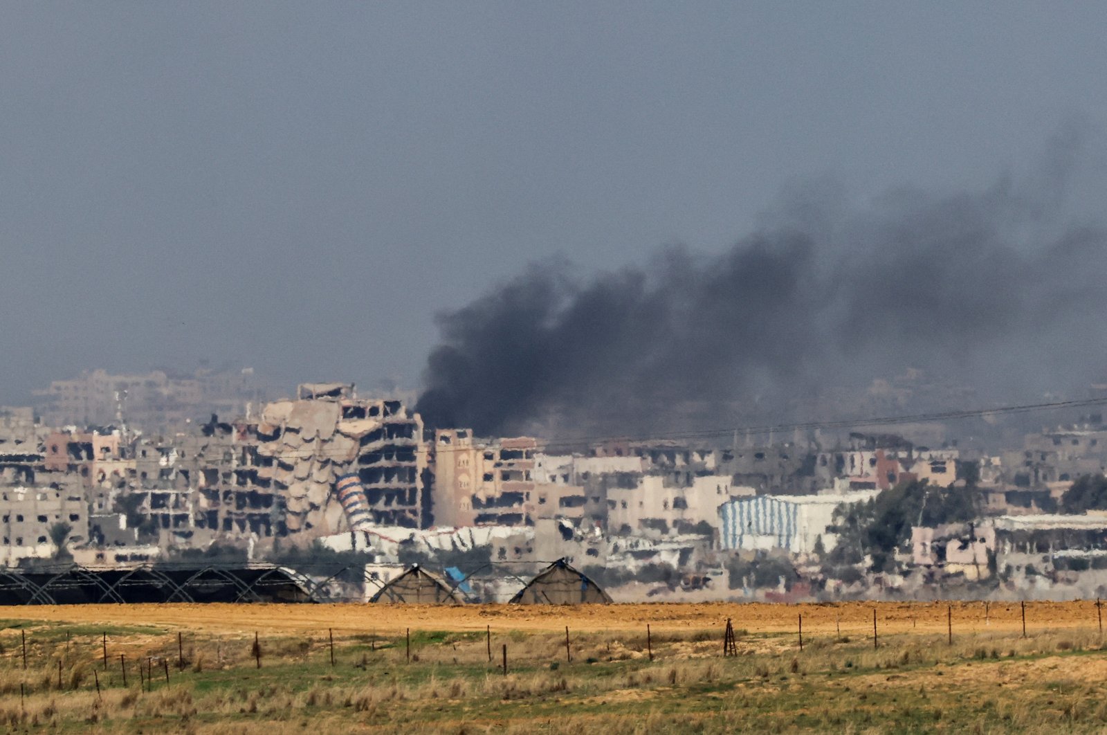 Smoke rises in Gaza as buildings are destroyed by Israeli strikes, as seen from southern Israel, Dec. 6, 2023. (Reuters Photo)