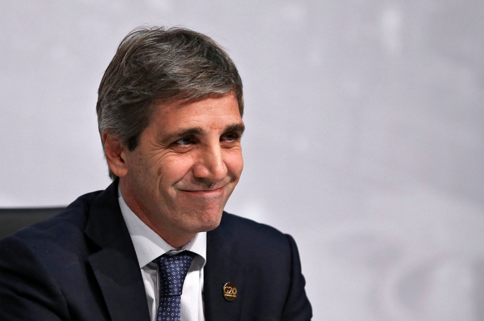 Argentina&#039;s Central Bank President Luis Caputo smiles as he gives a press conference along with Economy Minister Nicolas Dujovne (out of frame) in the framework of the G-20 meeting of Finance Ministers and Central Bank Governors, in Buenos Aires, Argentina, July 22, 2018. (AFP Photo)