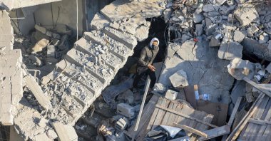 A man walks among the rubble of a building destroyed in Israeli bombardment in Rafah, southern Gaza Strip, Palestine, Dec. 7, 2023. (AFP Photo)