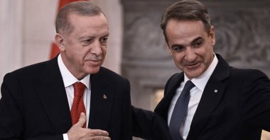 President Recep Tayyip Erdoğan (L) and Greek Prime Minister Kyriakos Mitsotakis leave after speaking to the press following their meeting in Athens during Erdogan's official visit to Greece, Dec. 7, 2023. (AFP Photo)