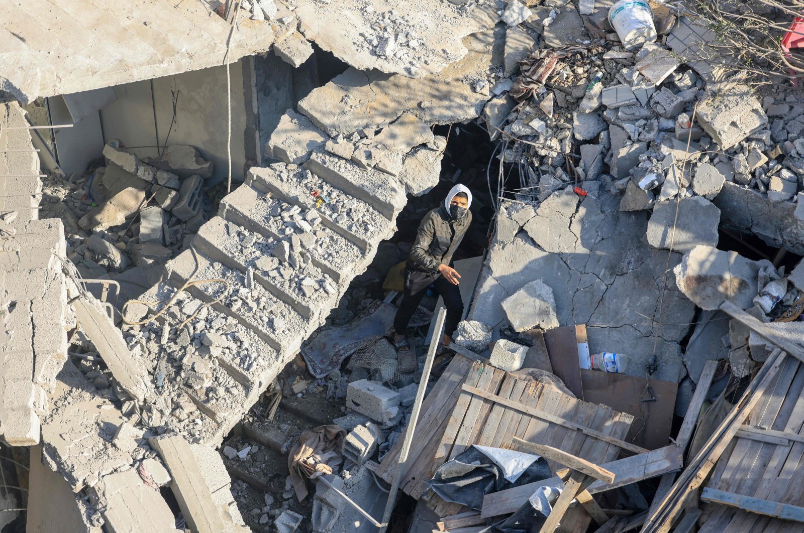 A man walks among the rubble of a building destroyed in Israeli bombardment in Rafah, southern Gaza Strip, Palestine, Dec. 7, 2023. (AFP Photo)