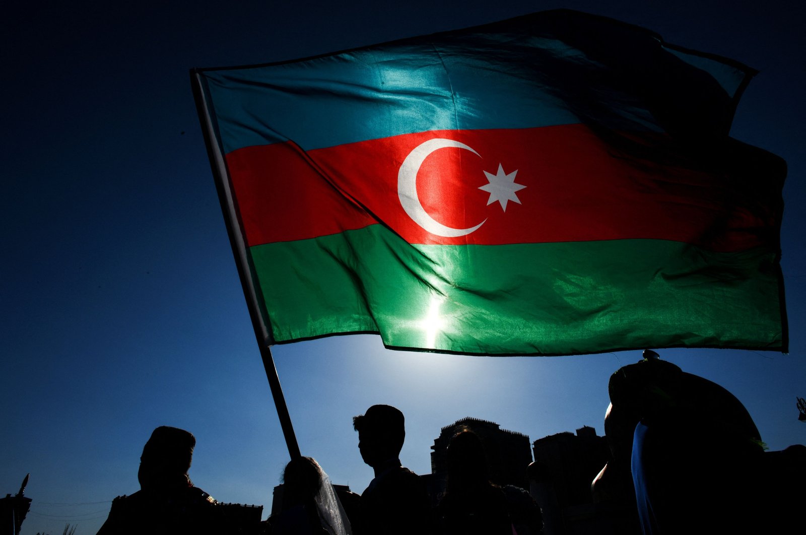 Schoolchildren wave an Azerbaijani flag in Baku, Azerbaijan, April 26, 2018. (AFP Photo)