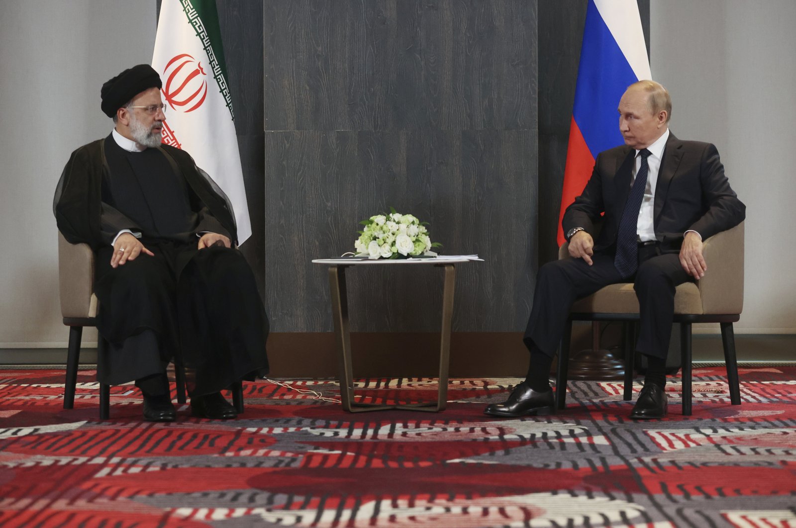 Russian President Vladimir Putin meets with Iranian President Ebrahim Raisi on the sidelines of the Shanghai Cooperation Organisation (SCO) summit in Samarkand, Uzbekistan, Sept. 15, 2022. (AP Photo)
