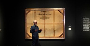 Miguel Angel Blanco, exhibition curator, gives some explanations about the back side of a painting called "Trompe l&#039;oeil of the stretcher of Moses rescued from the Waters" by French artist Victor Orsel at the Prado Museum in Madrid, Spain, Dec. 5, 2023. (AFP Photo)