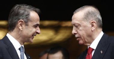 Greek Prime Minister Kyriakos Mitsotakis (L) talks with President Recep Tayyip Erdoğan after their meeting at Maximos Mansion in Athens, Greece, Dec. 7, 2023. (EPA Photo)