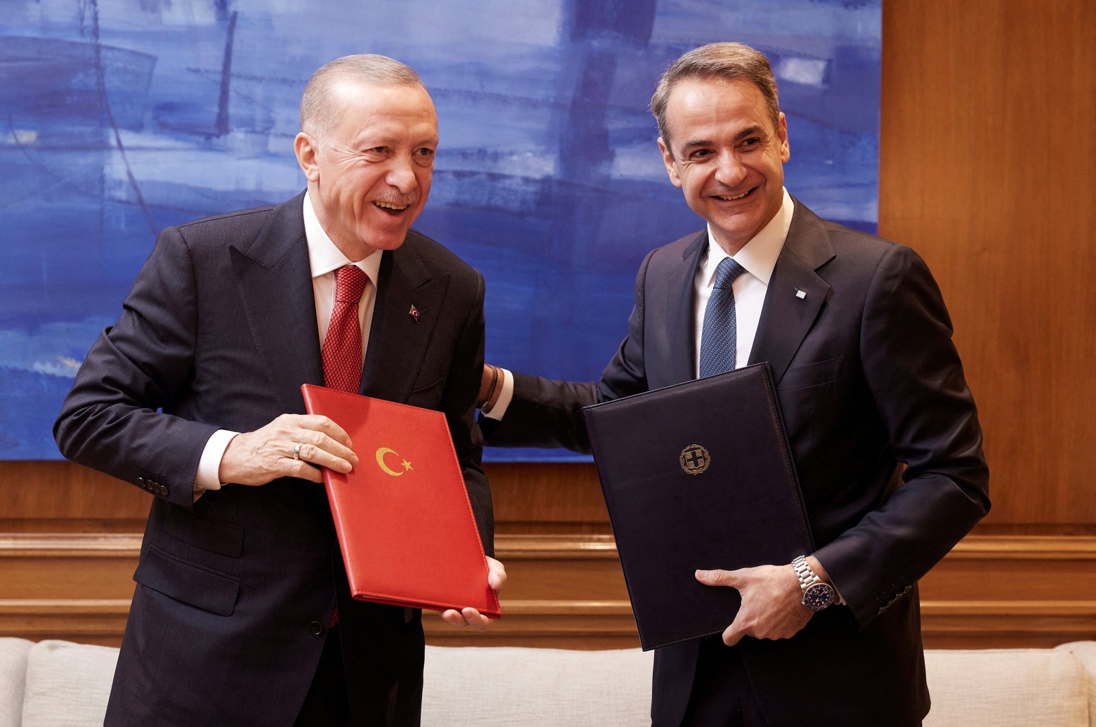 Greek Prime Minister Kyriakos Mitsotakis and President Recep Tayyip Erdoğan smile after signing a joint declaration to pursue good neighborly relations at the Maximos Mansion in Athens, Greece, Dec. 7, 2023. (Reuters Photo)