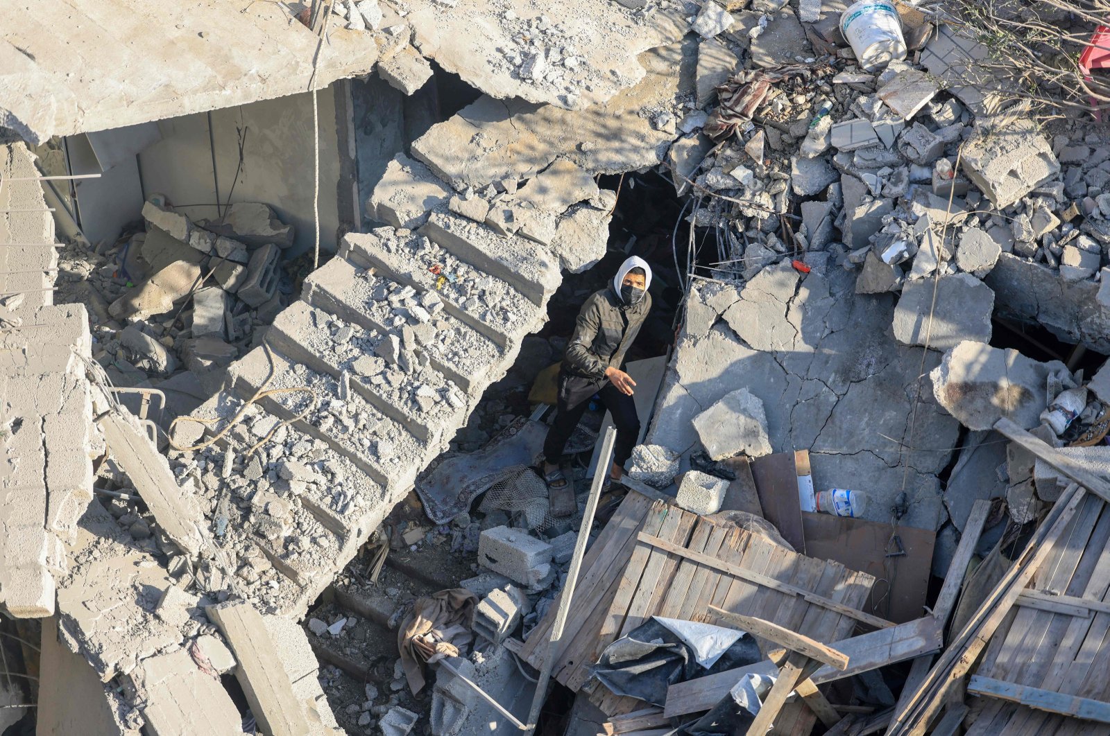 A man walks among the rubble of a building destroyed by Israeli bombardment overnight in Rafah on the southern Gaza Strip, Palestine, Dec. 7, 2023. (AFP Photo)