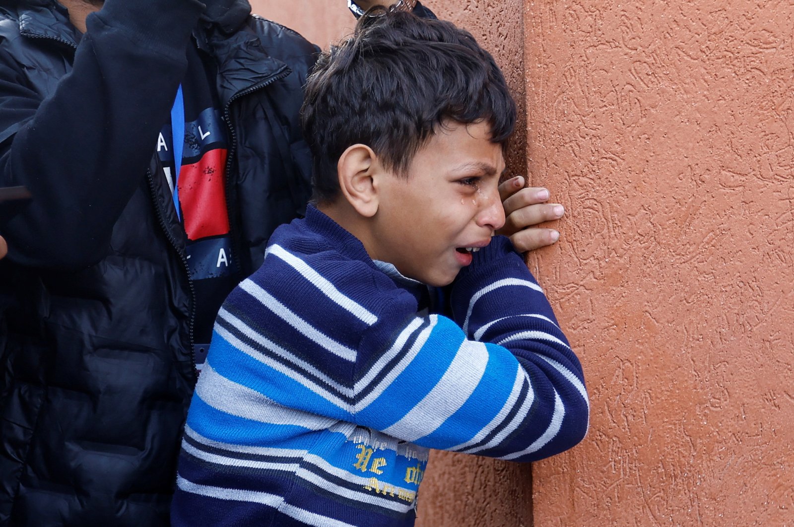 A Palestinian boy reacts as he attends the funeral of his loved ones killed in an Israeli raid in Khan Younis, southern Gaza Strip, Palestine, Dec. 10, 2023. (Reuters Photo)