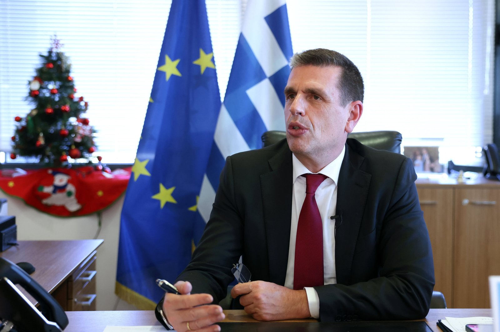 Greek Migration and Asylum Minister Dimitris Kairidis speaks in an interview, in Athens, Greece, Dec. 9, 2023. (AA Photo)
