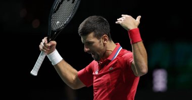 Serbia's Novak Djokovic reacts during the men's doubles semifinal tennis match between Italy and Serbia in the Davis Cup, Martin Carpena sports hall, Malaga, Spain, Nov. 25, 2023. (AFP Photo)