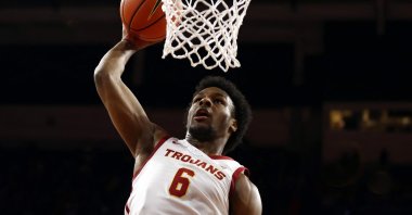 Bronny James #6 of the USC Trojans dunks the ball during warm ups prior to the SEC Championship game against the Long Beach State 49ers at Galen Center on, in Los Angeles, California, U.S., Dec. 10, 2023. (AFP Photo)