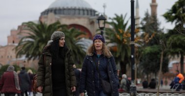 Marion Parks, a 55-year-old British woman from a village near Ipswich, Suffolk, accompanied by Tower Dental medical consultant Flora Yazdany, visits the old town while she is in the city for extensive dental treatment, Istanbul, Türkiye, Dec. 6, 2023. (Reuters Photo)