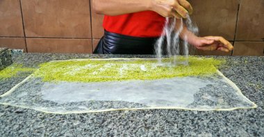 Making traditional crisp flaky pastry (katmer in Turkish) famous for Gaziantep, Türkiye. (Getty Images Photo)
