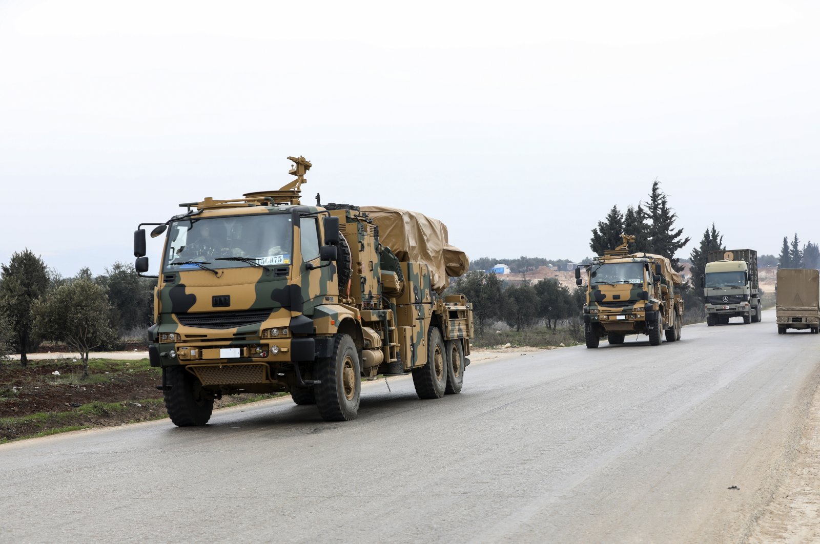A Turkish military convoy drives in the east of Idlib, Syria, Feb. 28, 2020. (AP Photo)