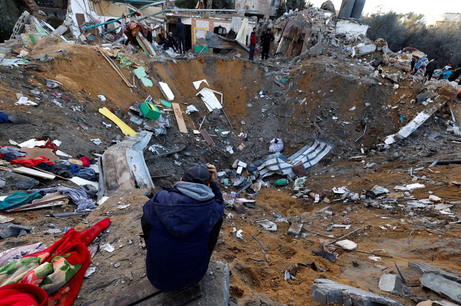A Palestinian looks on at the site of Israeli strikes on houses in Rafah, southern Gaza Strip, Palestine, Dec. 12, 2023. (Reuters Photo)