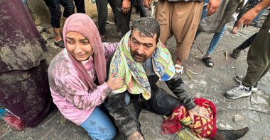 People react following an Israeli air strike on Palestinian houses in Rafah in the southern Gaza Strip, Palestine, Dec. 12, 2023. (Reuters Photo)