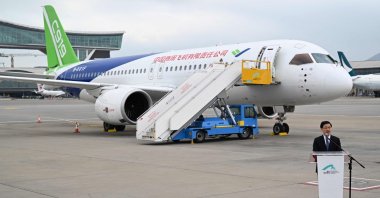 Hong Kong Chief Executive John Lee speaks in front of China&#039;s domestically produced C919 passenger jet while on display to the media at Hong Kong International Airport, Hong Kong, China, Dec. 13, 2023. (AFP Photo)