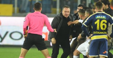 Turkish referee Halil Umut Meler is knocked to the ground after a punch by Ankaragücü&#039;s President Faruk Koca (3rd L) after the Turkish Süper Lig match between Ankaragücü and Rizespor, Ankara, Türkiye, Dec. 11, 2023. (EPA Photo)