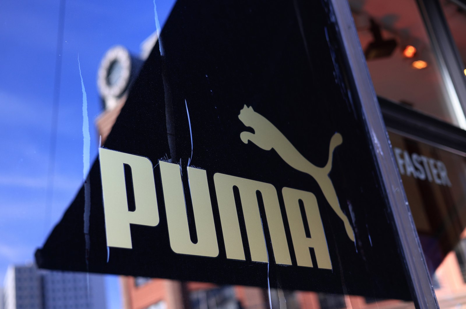 The logo of Puma SE displayed in the window of the flagship store, Berlin, Germany, March 1, 2023. (Getty Images Photo)