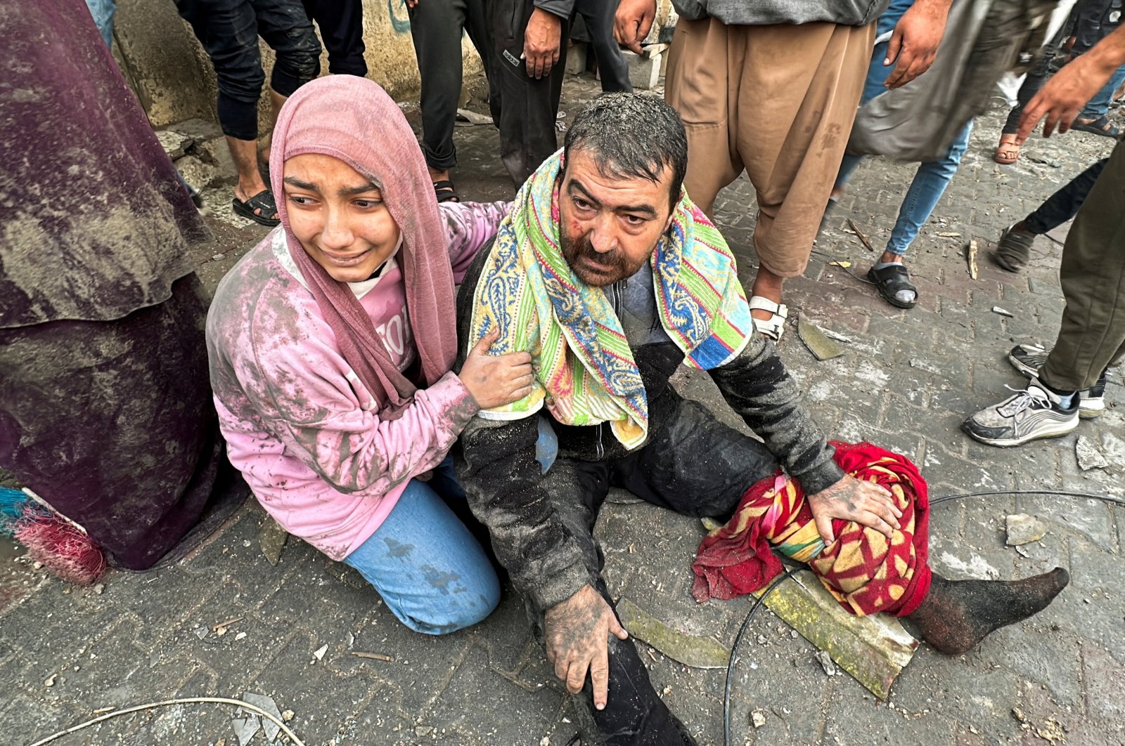 People react following an Israeli air strike on Palestinian houses in Rafah in the southern Gaza Strip, Palestine, Dec. 12, 2023. (Reuters Photo)