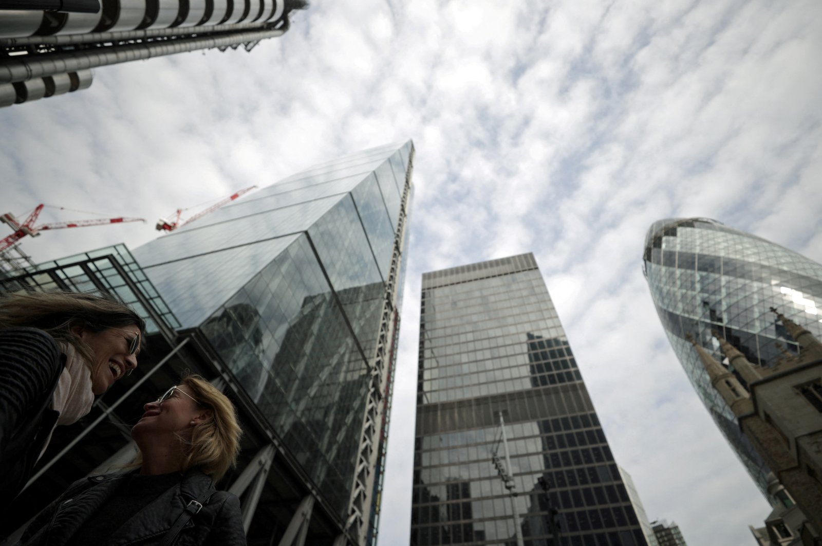 People walk through the City of London financial district in London, Britain, Sept. 13, 2021. (Reuters Photo)