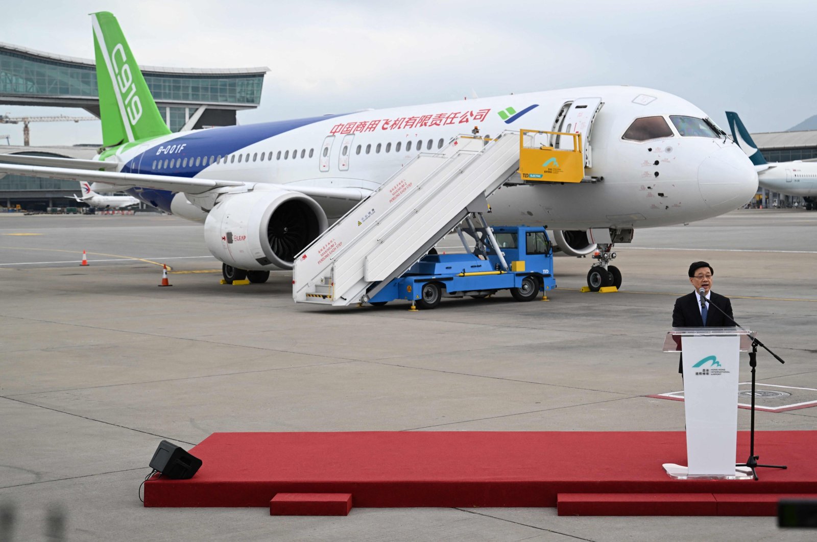 Hong Kong Chief Executive John Lee speaks in front of China&#039;s domestically produced C919 passenger jet while on display to the media at Hong Kong International Airport, Hong Kong, China, Dec. 13, 2023. (AFP Photo)