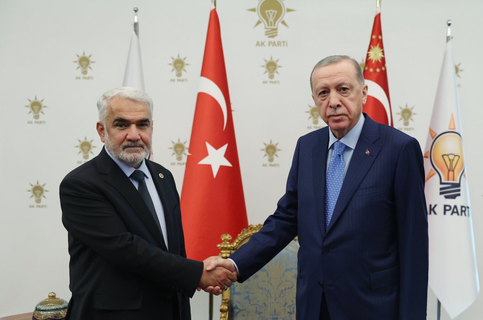 President Recep Tayyip Erdoğan shakes hands with HÜDA-PAR Chair Zekeriya Yapıcıoğlu, in the capital Ankara, Türkiye, December 13, 2023. (IHA Photo)